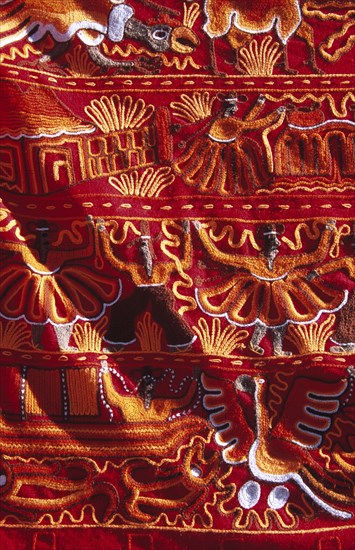 PERU, Near Cusco, Ollantaytambo, "Colourful patterned embroidered cloth in the market, Ollantaytambo, Sacred Valley of the Incas."