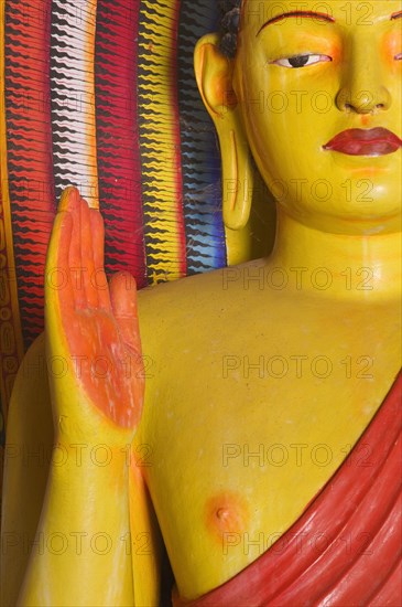 SRI LANKA, Anuradhapura, Detail of a Buddha statue in Isurumuniya Vihara (Rock Temple).