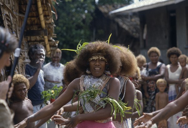 PACIFIC ISLANDS, Melanesia, Solomon Islands, "Malaita Province, Lau Lagoon, Foueda Island.  Girls performing wedding dance wearing multi-strand shell and coral necklaces."