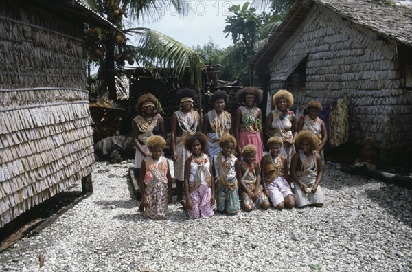 PACIFIC ISLANDS, Melanesia, Solomon Islands, "Malaita Province, Lau Lagoon, Foueda Island.  Group portrait of wedding dancers wearing multi-strand shell and coral necklaces."