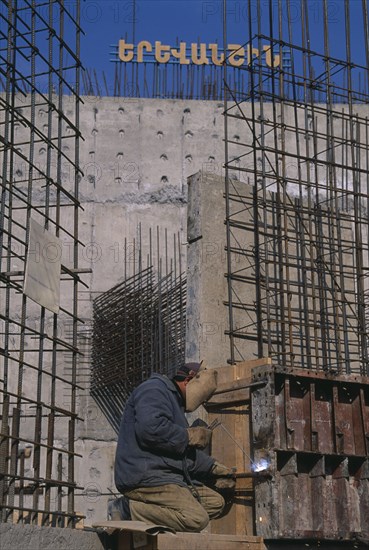 ARMENIA, Yerevan, Welder working on building of new cathedral to mark 1700 years of state Christianity.