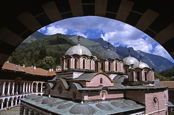 BULGARIA, Rila, "Nativity Church from balcony through arch, Rila Monastery."