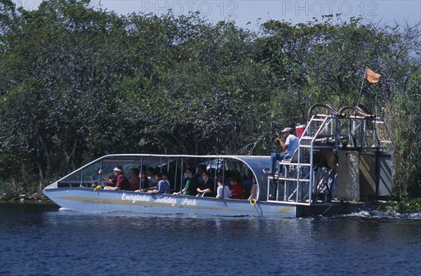 USA, Florida, Fort Lauderdale, Tourists Air boating in the Everglades National Park