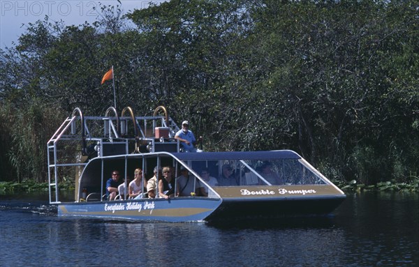 USA, Florida, Fort Lauderdale, Tourists Air boating in the Everglades National Park