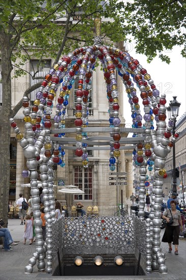 FRANCE, Ile de France, Paris, Colourful modern metal and glasswork entrance to the Metro in Place Colette