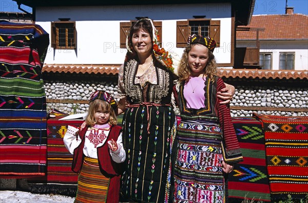 BULGARIA, Bansko, Mother and daughters wearing national costume