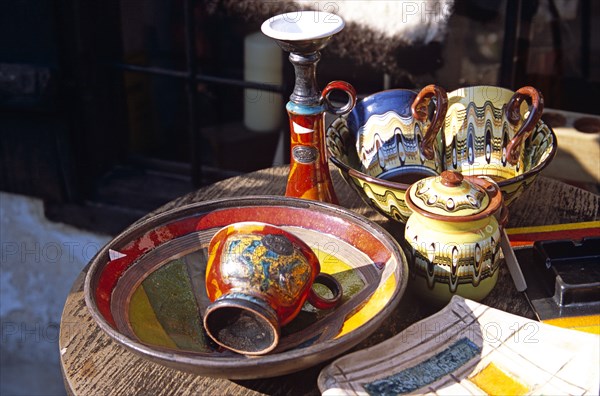 BULGARIA, Bansko, Traditional Bulgarian pottery on display outside gift and craft shop.