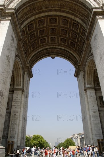 FRANCE, Ile de France, Paris, Tourists around the Tomb of The Unknown Soldier under the central arch of the Arc de Triomphe in Place de Charles De Gaulle