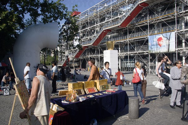 FRANCE, Ile de France, Paris, Artists selling their work amongst tourists in the Place Georges Pompidou in front of the Pompidou Centre in Beauborg Les Halle