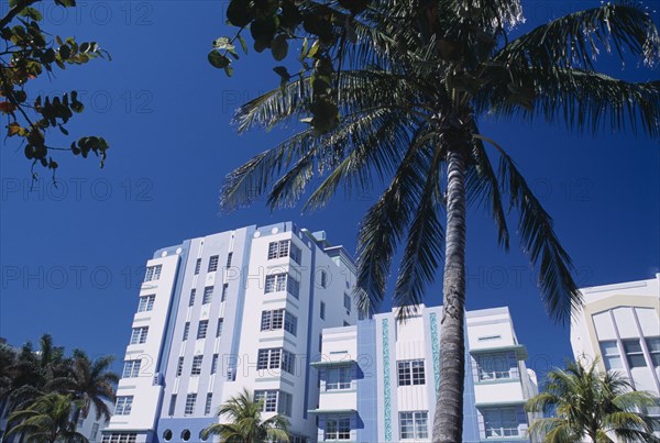 USA, Florida, Miami, South Beach. Ocean Drive. Park Central Hotel exterior with palm trees in the foreground