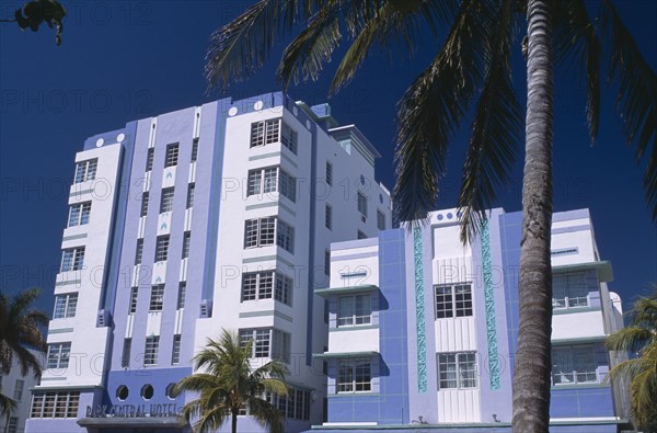 USA, Florida, Miami, South Beach. Ocean Drive. Park Central Hotel exterior with palm trees in the foreground