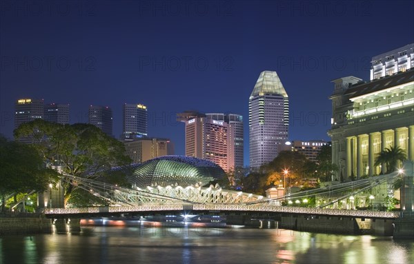 SINGAPORE, Esplanade, Night time view along the Singapore River towards Esplanade. Theatres on the Bay.