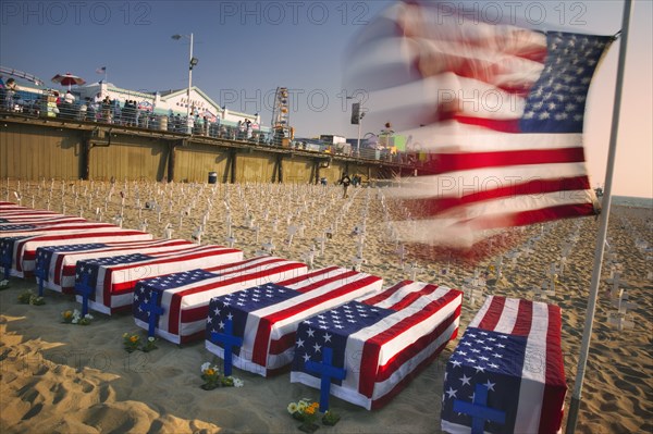 USA, California, Santa Monica, A graphic protest against the war in Iraq beneath Santa Monica Pier. Each white cross represents a member of the American armed forces who has lost their life