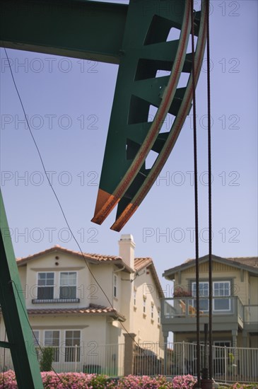 USA, California, Long Beach, "Close-up of an oil well in a residential district on Signal Hill, known locally as Porcupine Hill because of the numerous oil wells dotted around the area"