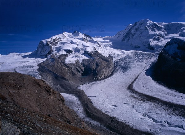 SWITZERLAND, Valais, Monte Rosa Mountains, "Snow covered mountains left to right, Dufourspitze 4545metres ( 14885 ft )  Liskam 4479metres ( 14668 ft ) Grenz Glacier right centre"