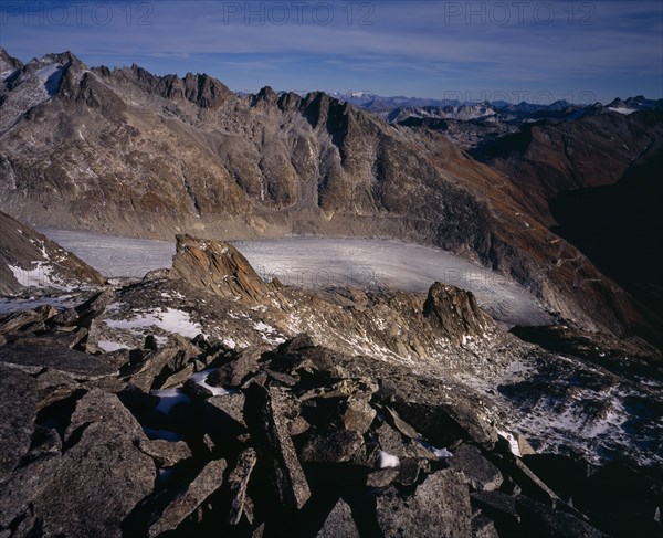 SWITZERLAND, Valais, Rhone Glacier, Glacier seen from Nagelisgratli path. Snow covered Galenstock 3584metres (11744ft) and Fukahorn Ridge beyond