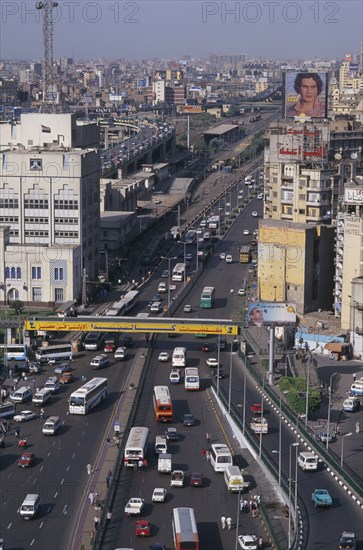 EGYPT, Cairo Area, Cairo, Elevated view over busy city road network with traffic running between tall buildings