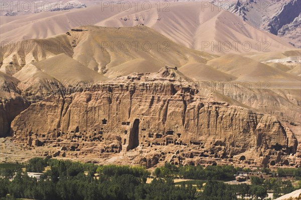 AFGHANISTAN, Bamiyan Province, Bamiyan , View of Bamiyan valley showing cliffs with empty niche where the famous carved Budda once stood (destroyed by the Taliban in 2001)