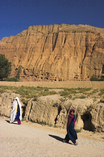 AFGHANISTAN, Bamiyan Province, Bamiyan , " Bamiyan, Remains of bazzar which was destroyed by the Taliban infront of empty niche where the famous carved Budda once stood (destroyed by the Taliban in 2001)"