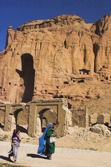 AFGHANISTAN, Bamiyan Province, Bamiyan , Remains of bazzar which was destroyed by the Taliban infront of empty niche where the famous carved Budda once stood (destroyed by the Taliban in 2001)