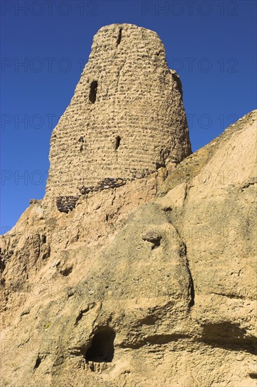 AFGHANISTAN, Bamiyan, Kakrak valley, "Watchtower at ruins which were once the site of a 21ft standing Buddha in a niche, discovered in 1030 and surrounded by caves whose Buddhists paintings thought to date from the 9th and 9th Centuries AD but removed by French archaeologists and put in the National musuem in Kabul "