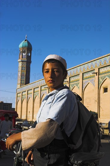 AFGHANISTAN, Herat, Boy outside the Friday Mosque or Masjet-eJam Originally laid out on the site of an earlier 10th century mosque in the year 1200 by the Ghorid Sultan Ghiyasyddin. Restoration started in 194