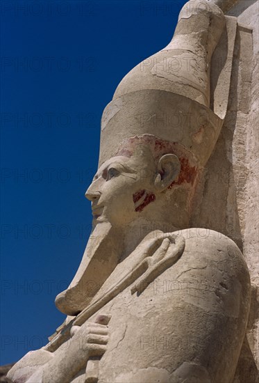 EGYPT, Nile Valley, Thebes, Deir-el-Bari. Hepshepsut Mortuary Temple. Side profile of Osiride statue of Hepshepsut represented as a male with a beard and crossed arms bearing the crook and flail.