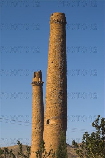 AFGHANISTAN, Herat, "The Mousallah Complex, Two of four minarets marking the corners of the long gone Madrassa built by Sultan Husain Baiquara last of the Timurid rulers  Two other minarets stand near Gaur Shad 's Mausoleum one with a mortar hole in it the other partly destroyed   Six of the other minarets were demolished by British troops in 1885, and 3 were destroyed by earthquakes "