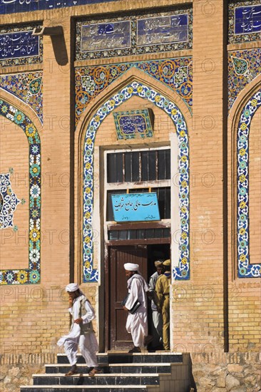 AFGHANISTAN, Herat, Men leaving Friday Mosque or Masjet-eJam Originally laid out on the site of an earlier 10th century mosque in the year 1200 by the Ghorid Sultan Ghiyasyddin. Restoration started in 194