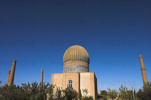 AFGHANISTAN, Herat, "The Mousallah Complex, Gaur Shad 's Mausoleum Part of the Mousallah Complex which included the remains of an old madrassa built by Queen Gaur Shad in 1417, wife of Timurid ruler Shah Rukh, son of Tamerlane,. There were several minarets in this complex but six were demolished by British troops in 1885, 3 were destroyed by earthquakes There are 6 remaining minarets one stands by the mausoleum with a mortar hole in it, another one also near the mausoleum is partly destroyed and four stand marking the corners of the long gone Madrassa built by Sultan Husain Baiquara last of the Timurid rulers"