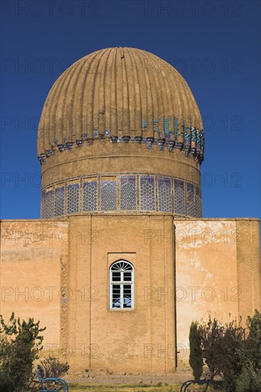 AFGHANISTAN, Herat, "The Mousallah Complex, Gaur Shad 's Mausoleum Part of the Mousallah Complex which included the remains of an old madrassa built by Queen Gaur Shad in 1417, wife of Timurid ruler Shah Rukh, son of Tamerlane,. There were several minarets in this complex but six were demolished by British troops in 1885, 3 were destroyed by earthquakes There are 6 remaining minarets one stands by the mausoleum with a mortar hole in it, another one also near the mausoleum is partly destroyed and four stand marking the corners of the long gone Madrassa built by Sultan Husain Baiquara last of the Timurid rulers "