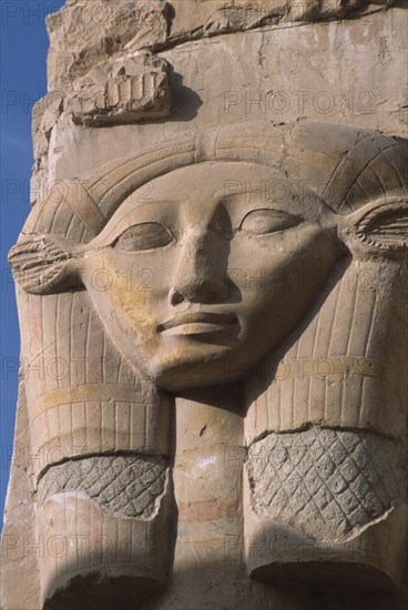 EGYPT, Nile Valley, Thebes, Deir-el-Bari. Hepshepsut Mortuary Temple. Carved column with head of Goddess Hathor represented with cows ears. One of the Hathoric columns.