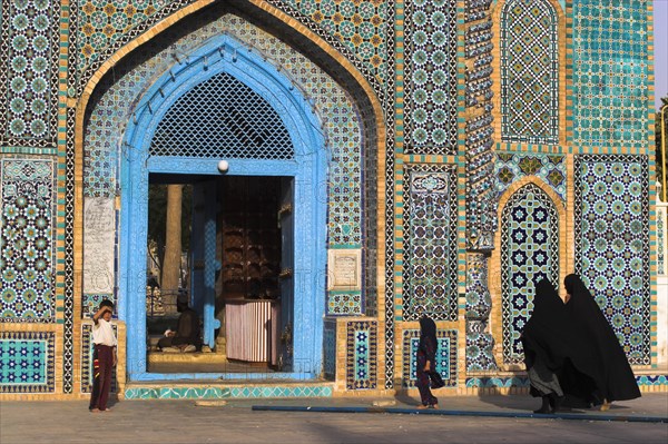 AFGHANISTAN, Mazar-I-Sharif, "Pilgrims at the Shrine of Hazrat of Ali (who was assissinated in 661) This shrine was built here in 1136 on the orders of Seljuk Sultan Sanjar, destroyed by Genghis Khan and rebuilt by Timurid Sultan Husain Baiqara in 1481, since restored. The shrine is famous for its white pigeons, it is said the site is so holy that if a grey pigeon flies here it will turn white within 40 day"