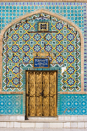 AFGHANISTAN, Mazar-I-Sharif, "Tiling round door, Shrine of Hazrat Ali (who was assissinated in 661) This shrine was built here in 1136 on the orders of Seljuk Sultan Sanjar, destroyed by Genghis Khan and rebuilt by Timurid Sultan Husain Baiqara in 1481, since restored. The shrine is famous for its white pigeons, it is said the site is so holy that if a grey pigeon flies here it will turn white within 40 day"