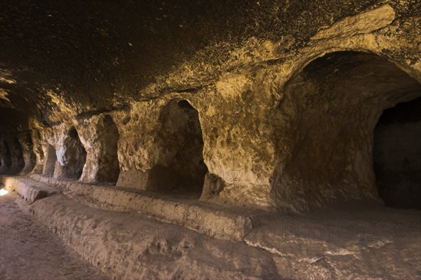 AFGHANISTAN, Samangan Province, Takht-I-Rusam, "2km south of the centre of Haibak, Buddhist caves know as Takht-I-Rusam (Rustam's throne), part of a stupa-monastery complex caeved from rock dating from the Kushano-Sasanian period 4th-5th century AD. Corridor off which the monks' living quarters are carved in cave 2 The caves are situated below the stupa and are where monks lived"