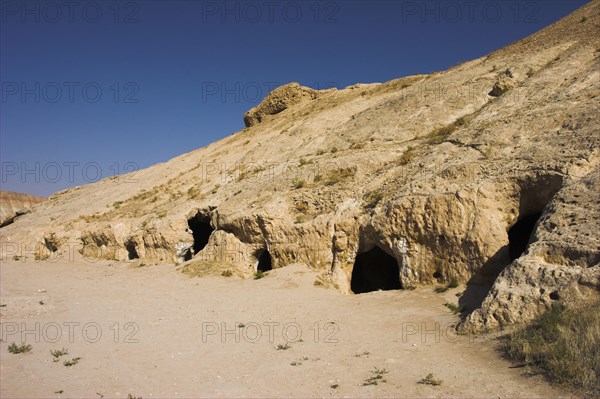 AFGHANISTAN, Samangan Province, Takht-I-Rusam, "2km south of the centre of Haibak, Buddhist caves know as Takht-I-Rusam (Rustam's throne), part of a stupa-monastery complex caeved from rock dating from the Kushano-Sasanian period 4th-5th century AD.