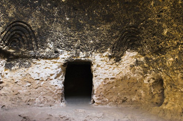 AFGHANISTAN, Samangan Province, Takht-I-Rusam, "2km south of the centre of Haibak, Buddhist caves know as Takht-I-Rusam (Rustam's throne), part of a stupa-monastery complex carved from rock dating from the Kushano-Sasanian period 4th-5th century AD. Inside cave 4 thought to be a bathroom