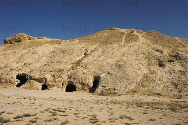 AFGHANISTAN, Samangan Province, Takht-I-Rusam, "2km south of the centre of Haibak, Buddhist caves know as Takht-I-Rusam (Rustam's throne), part of a stupa-monastery complex caeved from rock dating from the Kushano-Sasanian period 4th-5th century AD.