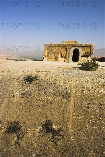 AFGHANISTAN, Samangan Province, Takht-I-Rusam, "2km south of the centre of Haibak, Buddhist stupa carved out of rock known as Top-I-Rustam (Rustam's throne) an early burial mound that contained relics of the Buddha, part of a stupa-monastery complex carved from rock dating from the Kushano-Sasanian period 4th-5th century AD.