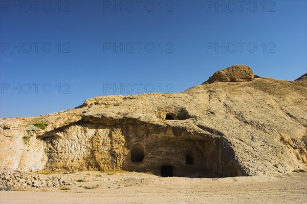 AFGHANISTAN, Samangan Province, Takht-I-Rusam, "2km south of the centre of Haibak, Buddhist caves know as Takht-I-Rusam (Rustam's throne), part of a stupa-monastery complex caeved from rock dating from the Kushano-Sasanian period 4th-5th century AD.