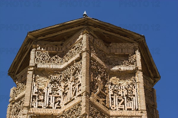 AFGHANISTAN, Ghazni, "One of two early 12th Century Minarets built by Sultan Mas'ud 111 and Bahram Shah served as models of the Minaret of Jam with square Kufic and Noshki script, Mounds at the foot of both minarets indiate they were once a part of two large buildings, archchaeologists believe these building were mosques"