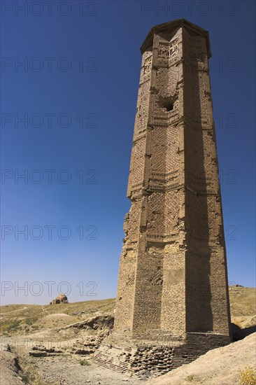 AFGHANISTAN, Ghazni, "Minaret of Bahram Shah, one of two early 12th Century Minarets the other built by Sultan Mas'ud 111, believed to have served as models for the Minaret of Jam, has square Kufic and Noshki script, Mounds at the foot of both minarets indicate they were once a part of two large buildings, archchaeologists believe these building were mosques"