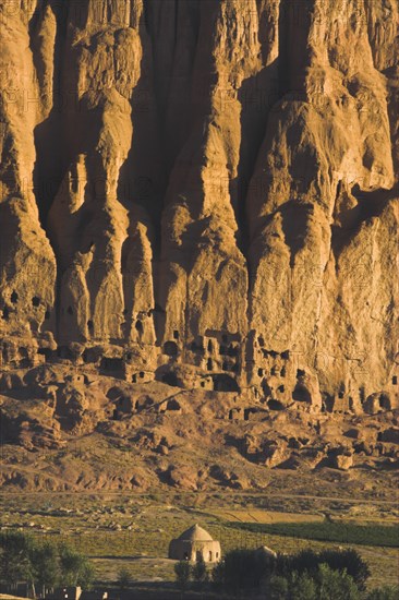 AFGHANISTAN, Bamiyan Province, Bamiyan, Tomb at base of cliffs near empty niche where the famous carved Budda once stood (destroyed by the Taliban in 2001