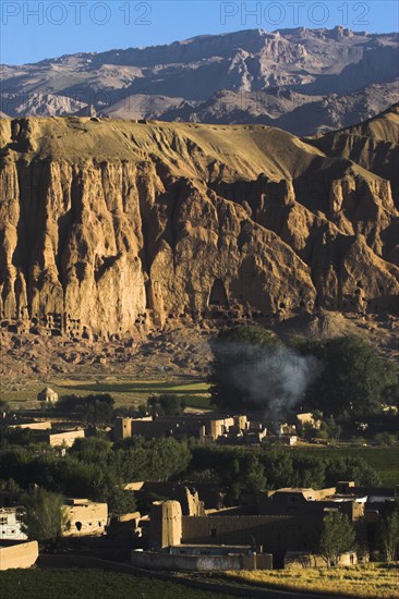 AFGHANISTAN, Bamiyan Province, Bamiyan, Village at base of cliffs near empty niche where the famous carved Budda once stood (destroyed by the Taliban in 2001