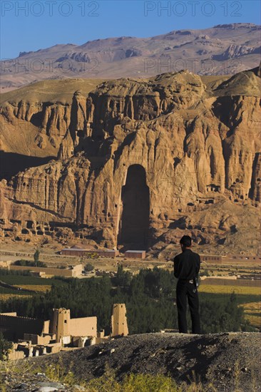 AFGHANISTAN, Bamiyan Province, Bamiyan, View of Bamiyan valley and village showing cliffs with empty niche where the famous carved Budda once stood (destroyed by the Taliban in 2001)