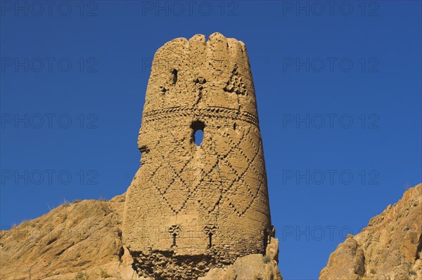AFGHANISTAN, Bamiyan Province, Bamiyan, "Kakrak valley, watchtower at ruins which were once the site of a 21ft standing Buddha in a niche, discovered in 1030 and surrounded by caves whose Buddhists paintings thought to date from the 9th and 9th Centuries AD but removed by French archaeologists and put in the National musuem in Kabul"