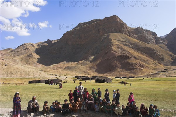 AFGHANISTAN, Ghor Province, Pal-Kotal-i-Guk, "Aimaq nomad camp, Aimaq man with children