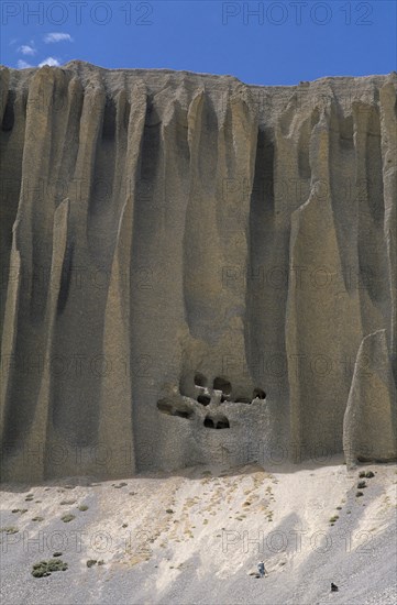 NEPAL, Mustang, Organ Pipe, Cave dwellings cut into ‘organ pipe’ shaped cliff formations near Yara village.
