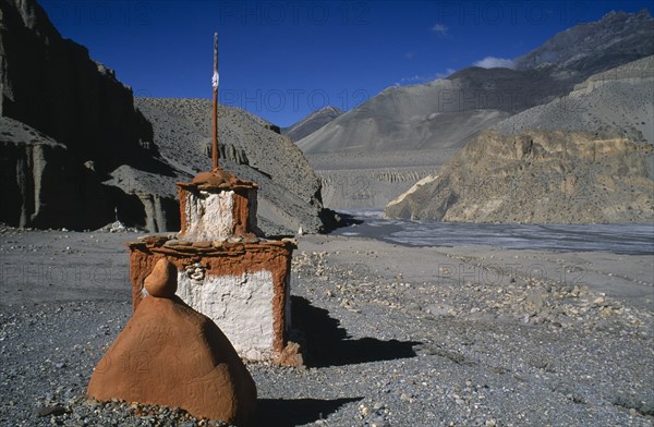 NEPAL, Mustang, Landscape, Stupa and sacred stones to protect travellers from the perils of the journey. Rtnd 2 VKB 15/5/2009