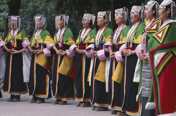 INDIA, Himachal Pradesh, Dharamsala, Tibetans wearing traditional costume to celebrate the birthday of the Dalai Lama